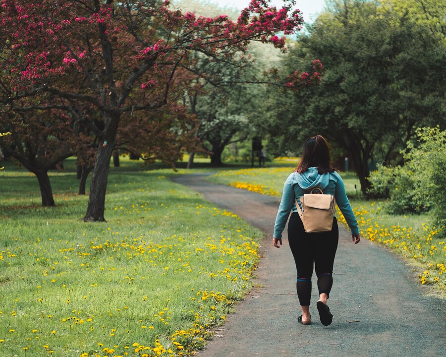 Image of woman on a walking path