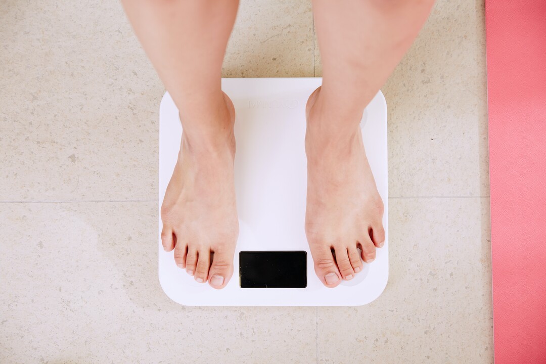 Photo of a person standing on a scale taken from above