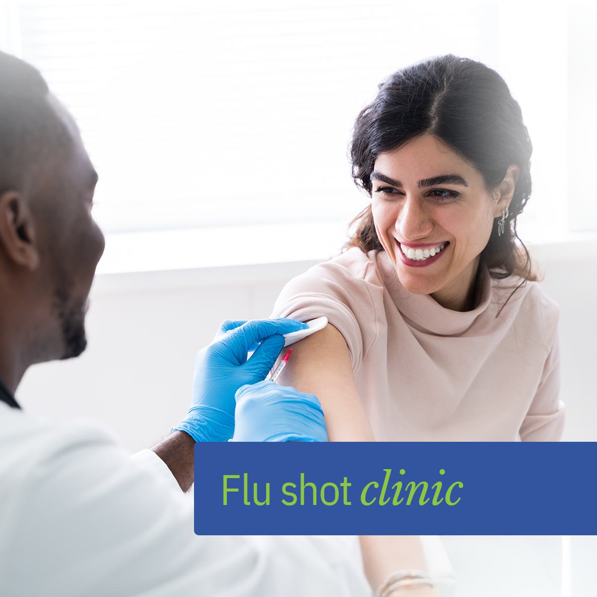 Woman receiving flu shot from doctor